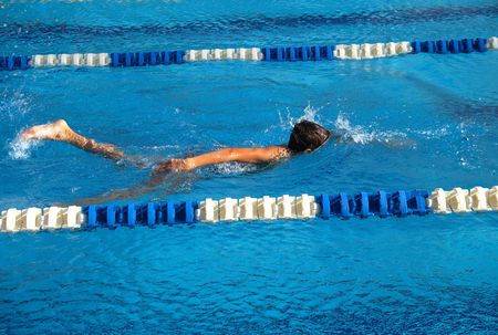 Heat of children on one path in the swimming poolの写真素材