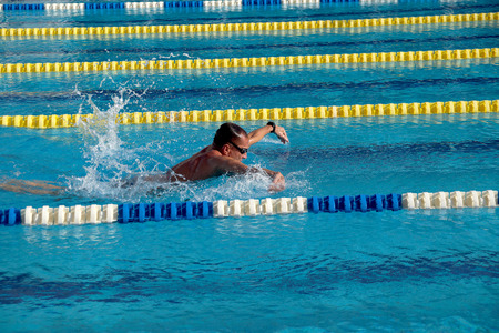 Swimmer in the big outdoor swimming poolの写真素材