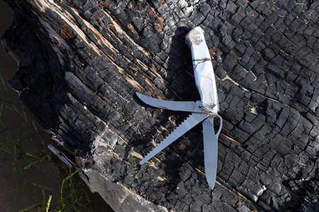 Folding multipurpose knife with various types of edgesの写真素材