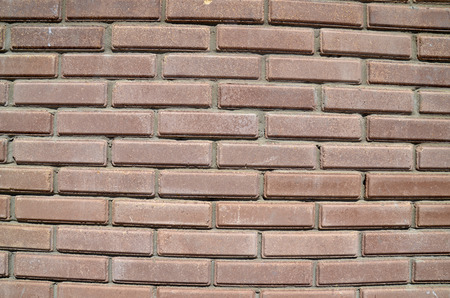House wall element from a brown brick