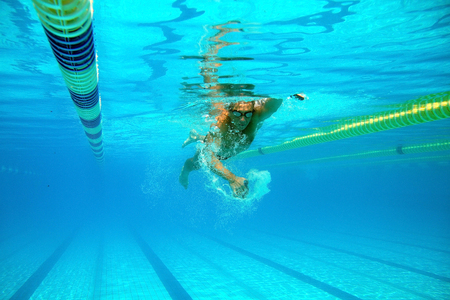 Swimmer in the big outdoor swimming poolの写真素材