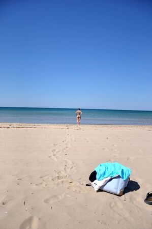 The girl on the sandy coast of the Black Seaの写真素材