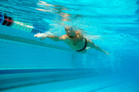 Swimmer in the big outdoor swimming poolの写真素材