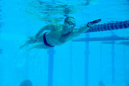 Underwater shooting of a swimmer in motion in a swimming poolの写真素材