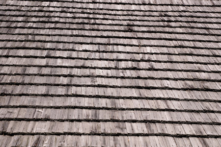 The roof of the roof of a rural house made of wooden planksの写真素材