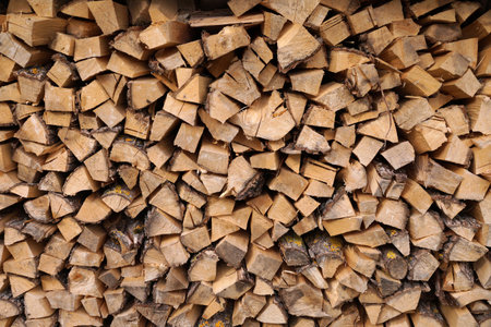 Laying chopped wood for a stove in a country cottageの写真素材
