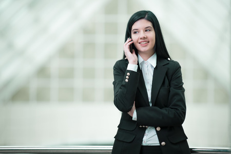 Smiling businesswoman talking on the phoneの写真素材