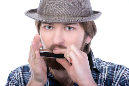 Man playing the harmonica.  isolated on white background