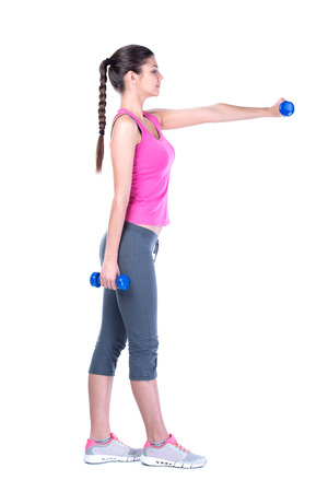 Fitness woman working out with dumbbells. Isolated on white .の写真素材