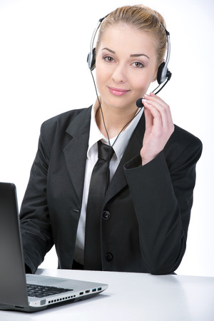 Woman customer service worker, call center smiling operator with phone headsetの写真素材
