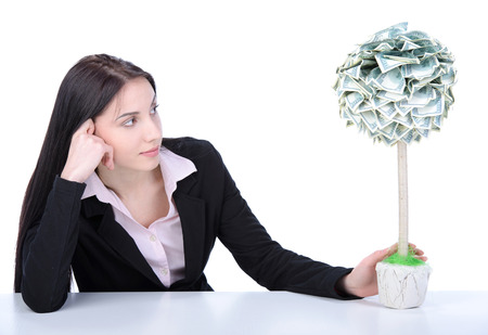 Young beautiful woman business grow money tree on white backgroundの写真素材