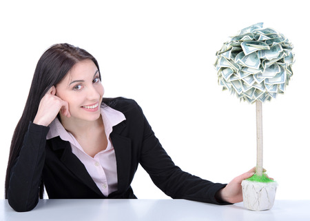 Young beautiful woman business grow money tree on white backgroundの写真素材