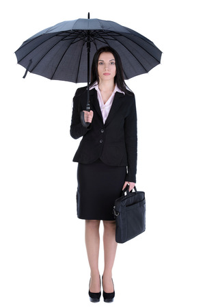 Portrait of a beautiful business woman holding a umbrella. の写真素材