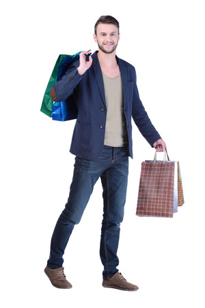 Young handsome man in suit with shopping bags. isolated on white backgroundの写真素材