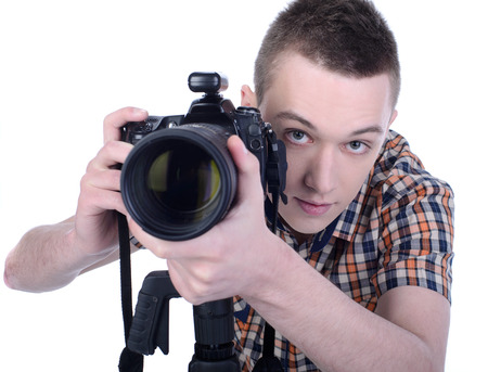 Portrait of young male photographer with professional digital camera