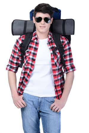 Young man with backpack isolated on white backgroundの写真素材