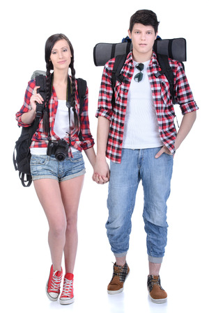 Couple tourists, woman and man, with backpacks, isolated on white backgroundの写真素材