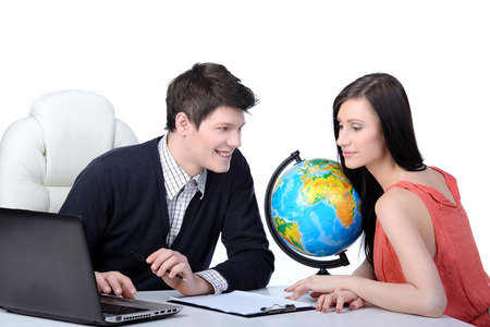 Travel agency. Man and woman at office decide to travel. studio shootingの写真素材