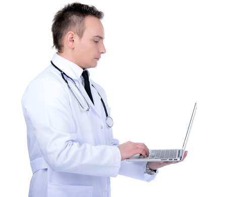 Happy male doctor showing on a laptop on a white backgroundの写真素材