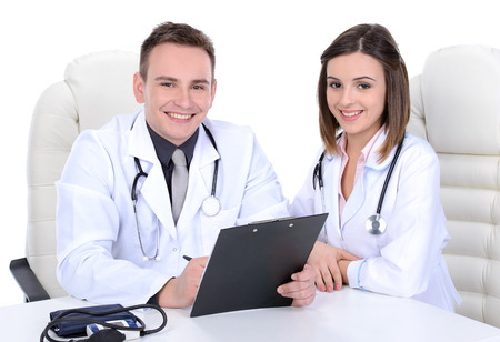 Male & female medical doctors isolated on whiteの写真素材