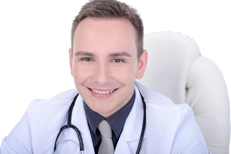 Portrait of confident young medical doctor on white backgroundの写真素材