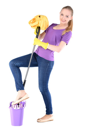 Young beautiful blonde housewife cleaning isolated on white backgroundの写真素材