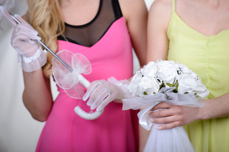 Two girlfriends - bridesmaids- having fun - looking for dresses for weddingの写真素材