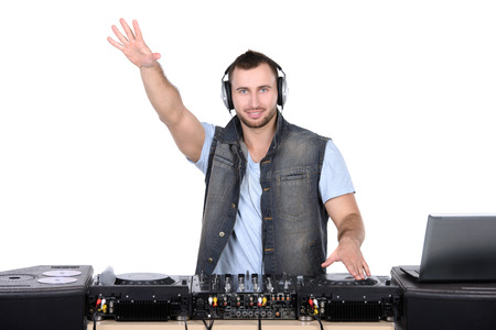Cool DJ at work  Happy young men spinning on turntable while isolated on whiteの写真素材