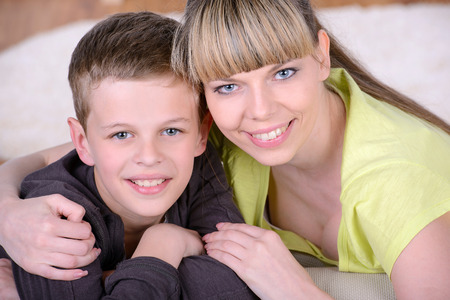Portrait of Mother with happy son at homeの写真素材