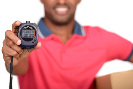 Fast delivery  Timer for foreground  African american delivery man carrying parcel and presenting...