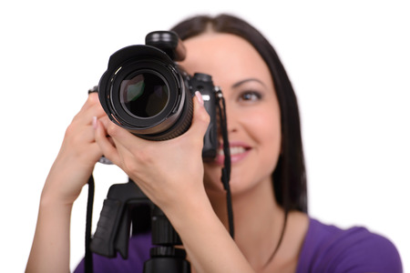 Attractive woman photographer at work in his studio