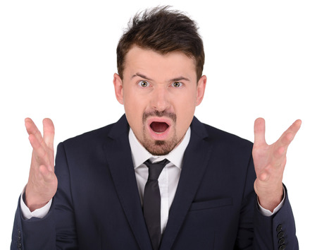 Portrait of emotional businessman, isolated on white backgroundの写真素材
