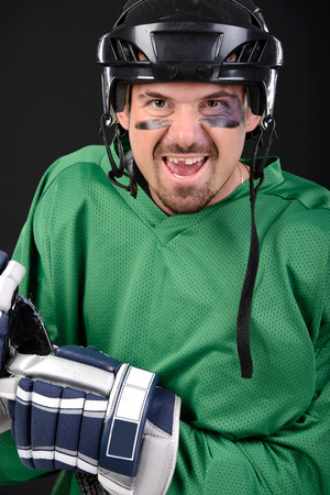Funny hockey player smiling, bruise around the eyeの写真素材