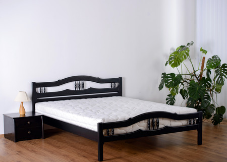 Beautiful Clean and Modern Bedroom with empty wallの写真素材