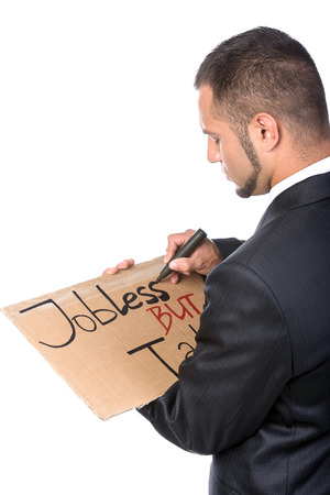 Young man is writing sign tablet for job search.の写真素材