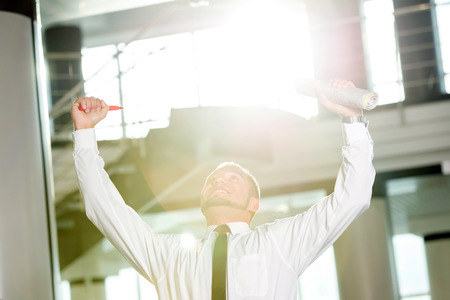 Concept of job search. Happy young man, found a job.の写真素材