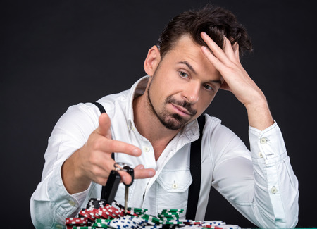 Portrait of poker player lost his car in the poker game.の写真素材