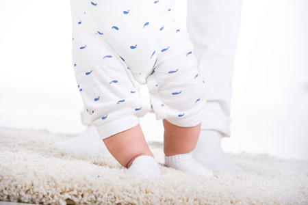 Close-up of the charming small legs doing the first steps.の写真素材