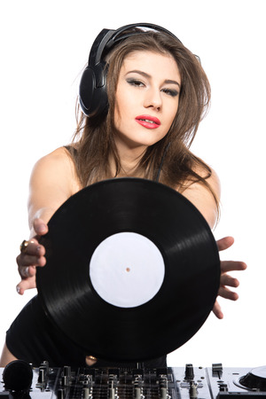 Woman dj portrait with vinyl record and headphones, isolated on white background.の写真素材