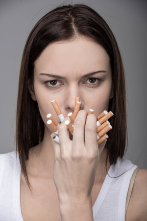 Young woman with many cigarettes.
Concept of quit smoking.の写真素材