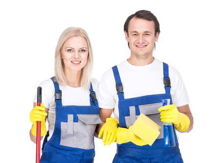 Young smiling cleaner man and woman. Housework. Isolated on white background.の写真素材
