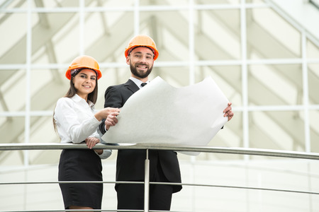 Young male and female architect in the modern office.の写真素材