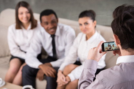 Group of business people in office during the break are making the photo.の写真素材