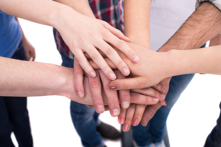 Close-up hands of a group of people. Friendship.