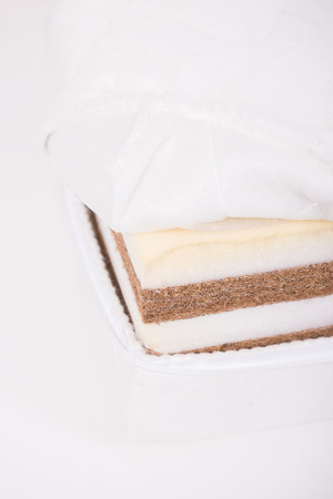Mattress made of coconut fiber, that supported you to sleep well all night isolated on white background.の写真素材