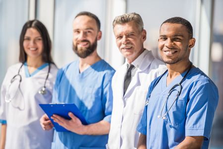 The attractive smiling medical group in hospital.の写真素材