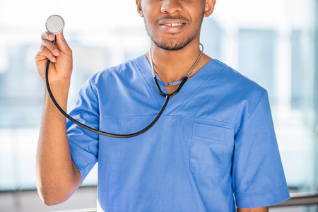 Close-up. Medicine concept. African doctor with stethoscope.の写真素材