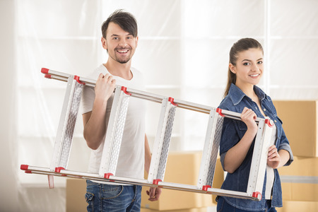 The young happy couple. Moving, purchase of new habitation.の写真素材