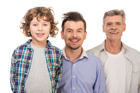 Generation portrait. Grandfather, father and son, isolated a white background.