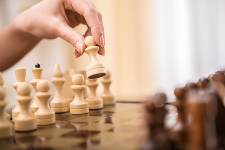Image of female hand is playing chess.の写真素材
